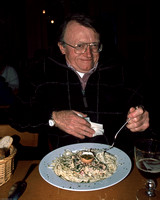 Father Bob eating pasta in Ghent