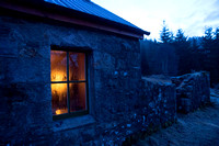 Candlelight from the bothy in the cold of early morning